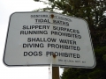 Signs for the tidal baths at Macmasters Beach